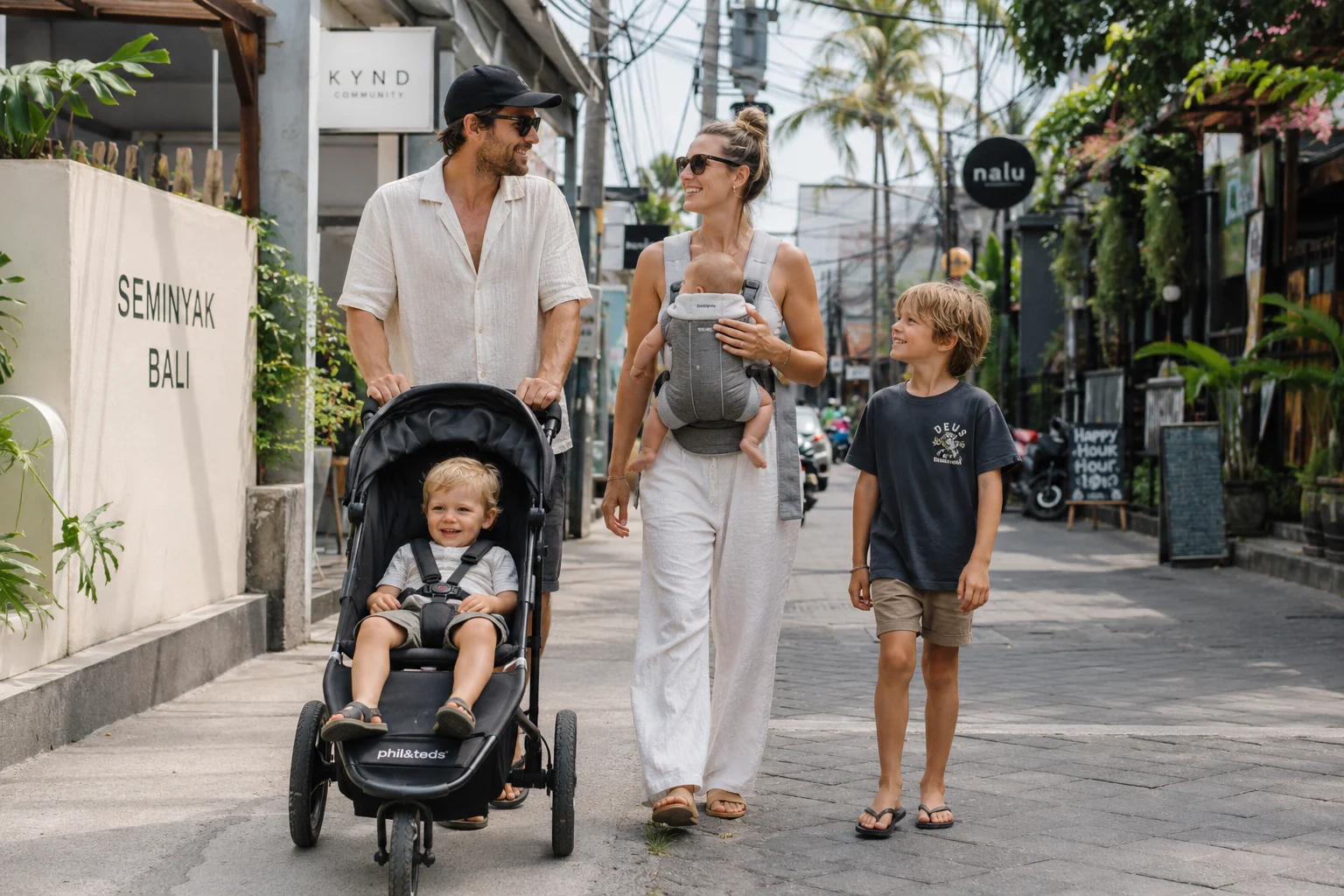 Couple walking with their baby in Seminyak, Bali